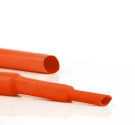 Deux gaines thermorétractables d'isolation de jeu de barres HBTH orange, une dans la taille d'origine et une rétrécie à deux épaisseurs.